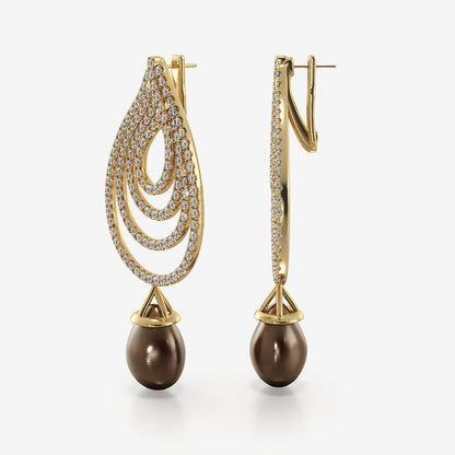 The Inara earrings and pendant set are handcrafted in yellow gold and display a dazzling collection of dripping diamonds culminating in a water drop of pearl. The Inara Set spills magic into your everyday life, and we hope they bring you a renewed sense of self every time you put them on. (Includes Pendant)