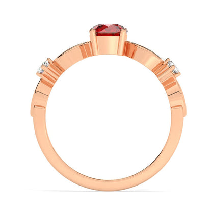 The Amreen ring imitates small branches intwined to hold between them the sweet fruit of love, the small heart that adds a pop of colour to the piece.