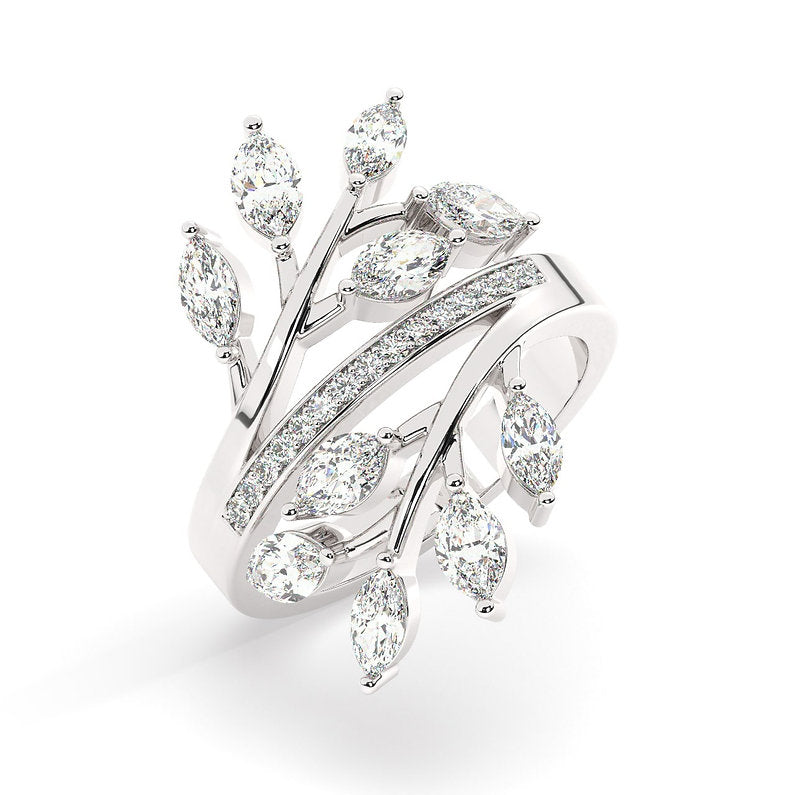 A wrap ring that crosses over and lays on your finger perfectly to flaunt the beautifully cut diamonds that look like little leaves covered with due drops.